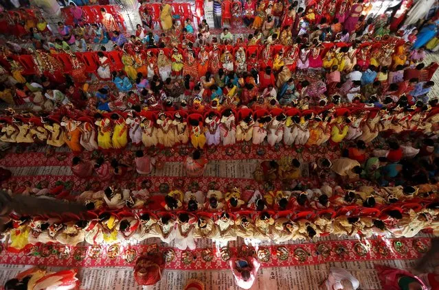 Hindu devotees worship young girls dressed as Kumaris during rituals to commemorate Navratri festival inside Adyapith temple on the outskirts of Kolkata, India, April 15, 2016. (Photo by Rupak De Chowdhuri/Reuters)