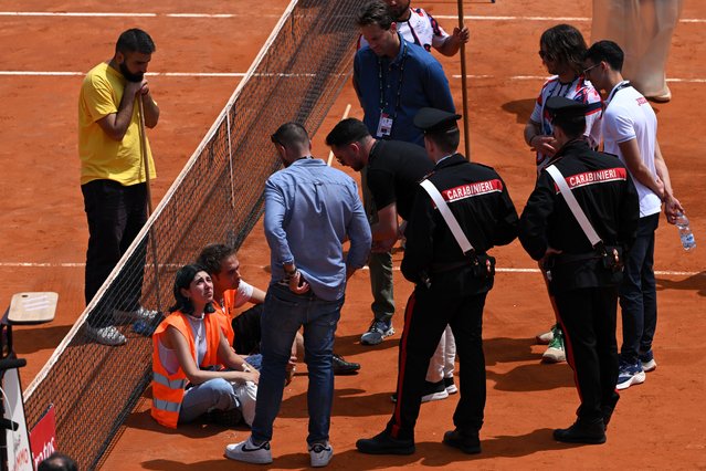 Protesters block the court during the Men's Doubles Round of 16 match between Marcelo Arevalo of El Salvador and Mate Pavic of Croatia and Santiago Gonzalez of Mexico and Edouard Roger-Vasselin of France on Day Eight of Internazionali BNL D'Italia at Foro Italico on May 13, 2024 in Rome, Italy. (Photo by Mike Hewitt/Getty Images)