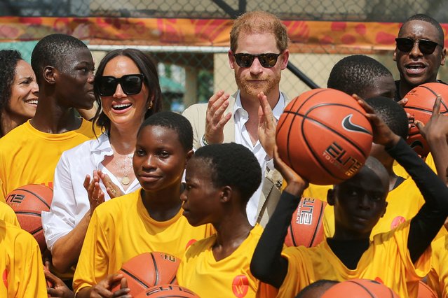Britain's Prince Harry, Duke of Sussex and Meghan, Duchess of Sussex attend a basketball event in Lagos, Nigeria, on May 12, 2024. (Photo by Akintunde Akinleye/Reuters)