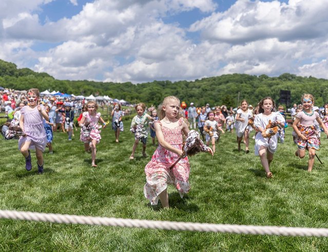 Kids compete in the stick horse race during the 83rd running of the Iroquois Steeplechase at Percy Warner Park in Nashville, Tenn. on May 11, 2024. (Photo by Alan Poizner/The Tennessean via USA TODAY Network)