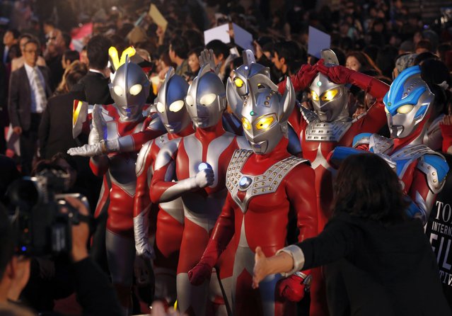 Characters from Japanese television series Ultraman walk on the red carpet during the opening event of the Tokyo International Film Festival in Tokyo on October 23, 2014. (Photo by Yuya Shino/Reuters)