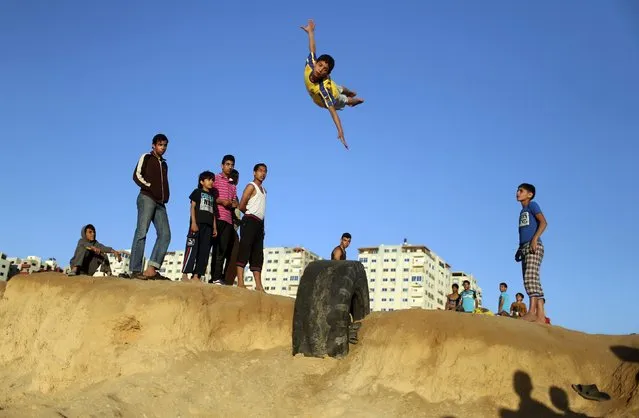 A Palestinian youth practices his parkour skills at the Shati refugee camp in Gaza City April 27, 2014. (Photo by Mohammed Salem/Reuters)