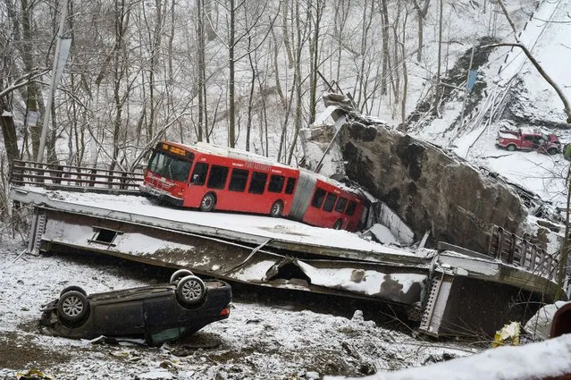 A collapsed bridge along Forbes Avenue near Frick Park in Pittsburgh, Pennsylvania, U.S., on Friday, January 28, 2022. A major bridge in Pittsburgh has collapsed this morning, hours before President Joe Biden is scheduled to visit the city to tout his signature bipartisan infrastructure law. (Photo by Justin Merriman/Bloomberg)