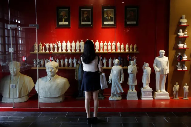 A visitor looks at a display of porcelain figures of the late Chinese Chairman Mao Zedong at Jianchuan Museum Cluster in Anren, Sichuan Province, China, May 13, 2016. (Photo by Kim Kyung-Hoon/Reuters)