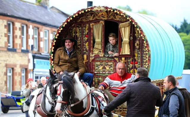 People arrive for the start of the Appleby Horse Fair, the annual gathering of gypsies and travellers in Appleby, Cumbria, on June 5, 2014. (Photo by Peter Byrne/PA Wire)