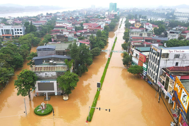 A handout photo made available by Vietnam News Agency shows flood waters surrounding buildings in Yen Bai city, Yen Bai Province, Vietnam 09 September 2024. According to sate media, at least 3,500 households have been evacuated in Yen Bai due to floods, after powerful Typhoon Yagi hit northern Vietnam over the weekend. (Photo by Tuan Anh/Vietnam News Agency/EPA/EFE)