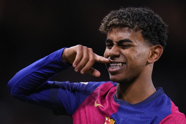 Barcelona's Lamine Yamal celebrates after scoring his side's third goal during the Spanish La Liga soccer match between Real Madrid and Barcelona at the Santiago Bernabeu stadium in Madrid, Spain, Saturday, October 26, 2024. (Photo by Manu Fernandez/AP Photo)