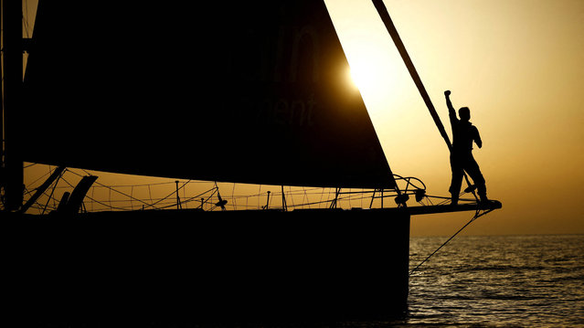 China's skipper and Paralympic athlete Xu Jingkun poses on his IMOCA Singchain Team Haikou during a training session for the solo non-stop round-the-world Vendee Globe sailing race, off the coast of Les Sables-d'Olonne, France, on October 31, 2024. (Photo by Stephane Mahe/Reuters)