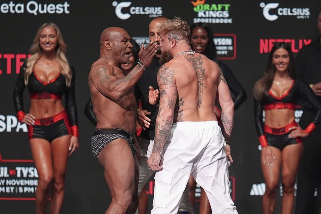 Mike Tyson, left, slaps Jake Paul during a weigh-in ahead of their heavyweight bout, Thursday, November 14, 2024, in Irving, Texas. (Photo by Julio Cortez/AP Photo)