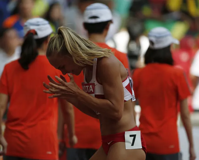 Stina Troest of Denmark reacts after her women's 400 metres hurdles heat at the 15th IAAF World Championships at the National Stadium in Beijing, China August 23, 2015. (Photo by David Gray/Reuters)