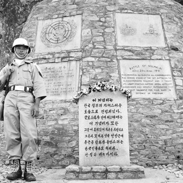 A Korean soldier guards the Gloster Hill Memorial, situated in the demilitarized zone between North and South Korea. The memorial commemorates the British soldiers of the Gloucestershire Regiment who defended this mountain pass against the Chinese communists during the Korean War. 23rd June 1959. (Photo by Keystone Features)