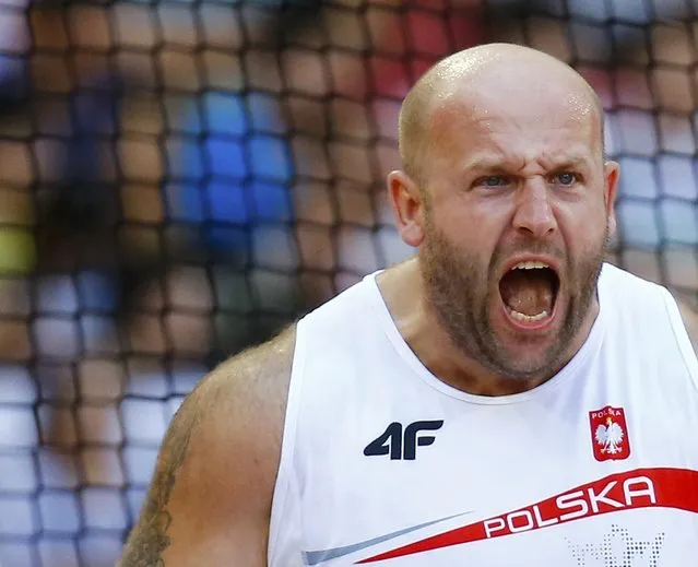 Piotr Malachowski of Poland reacts as he competes in the men's discus throw qualification event at the 15th IAAF World Championships at the National Stadium in Beijing, China, August 27, 2015. (Photo by Kai Pfaffenbach/Reuters)