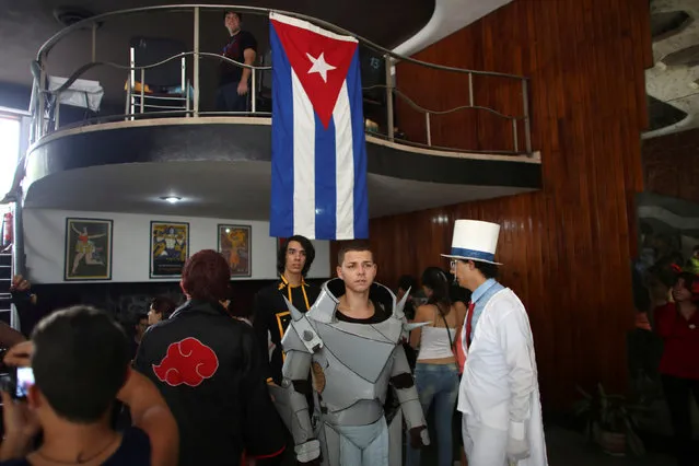 Participants are seen at the entrance of a cinema where the Cuban Otaku festival is taking place in Havana, Cuba, July 24, 2016. (Photo by Alexandre Meneghini/Reuters)