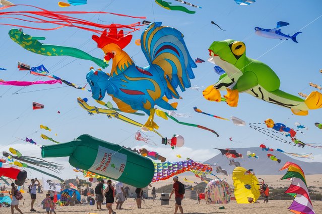 Kites flyers across the world descend on the beach near Corralejo on Fuerteventura Canary Islands, Spain on November 11, 2023 for the 2023 International Kite festival; now in its 36th year. (Photo by Alan Dawson/Alamy Live News)