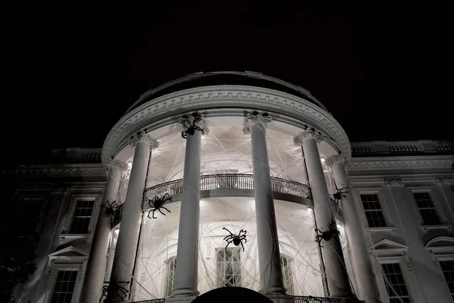 Spiders are seen decorating the White House for Halloween October 28, 2017 in Washington, DC. (Photo by Brendan Smialowski/AFP Photo)