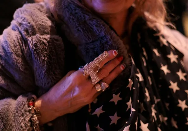 A ring in the shape of a gun worn by Ahedy Aldina of Brooklyn, New York, during an election night event for New York Republican gubernatorial candidate Congressman Lee Zeldin in New York, New York, USA, 08 November 2022. The US midterm elections are held every four years at the midpoint of each presidential term and this year include elections for all 435 seats in the House of Representatives, 35 of the 100 seats in the Senate and 36 of the 50 state governors as well as numerous other local seats and ballot issues. (Photo by Justin Lane/EPA/EFE)