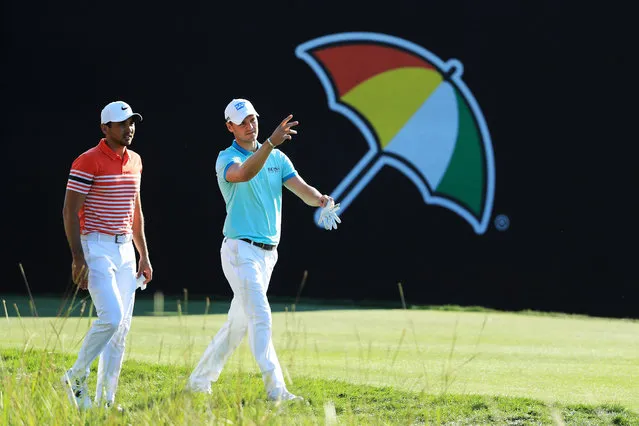 Jason Day of Australia and Martin Kaymer of Germany walk on the 18th hole during the second round of the Arnold Palmer Invitational Presented By MasterCard at Bay Hill Club and Lodge on March 17, 2017 in Orlando, Florida. (Photo by Richard Heathcote/Getty Images)