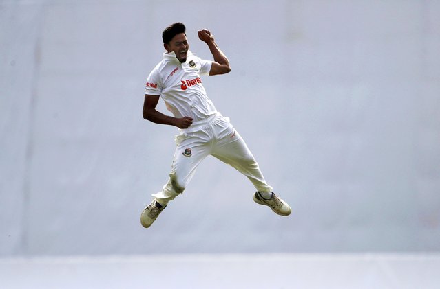 Bangladesh's Taijul Islam leaps in the air to celebrate the wicket of India's Shubman Gill on the day two of the second cricket test match between Bangladesh and India, in Dhaka, Bangladesh, Friday, December 23, 2022. (Photo by Surjeet Yadav/AP Photo)
