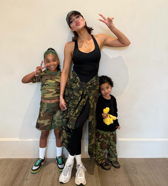 American media personality Khloe Kardashian poses with True and Tatum during “camo day” at school on June 17, 2025. (Photo by khloekardashian/Instagram)
