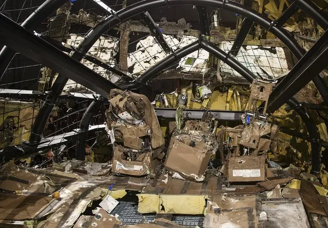 The reconstructed cockpit of the Malaysia Airlines Flight MH17 is seen after the presentation of the final report regarding its crash, in Gilze Rijen, the Netherlands, October 13, 2015. (Photo by Michael Kooren/Reuters)