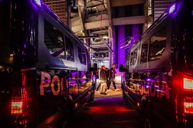 Police officers escort fans in the vicinity of the Santiago Bernabeu stadium after the second semi-final of the Copa del Rey between Real Madrid and FC Barcelona, March 2, 2023, in Madrid, Spain. The first leg of the Copa del Rey semifinal between Real Madrid and FC Barcelona was played today in a first round match for a place in the grand final at La Cartuja. At the end of the match, FC Barcelona beat Real Madrid with a 0-1 score. (Photo by Carlos Lujan/Europa Press via Getty Images)