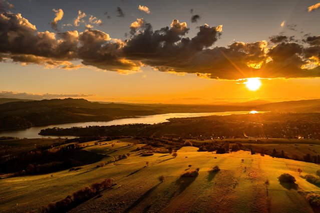 A picture taken with a drone shows sunset in Czorsztyn village, southern Poland, 19 April 2025. (Photo by Lukasz Gagulski/EPA/EFE)