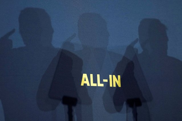 The shadow of U.S. President Donald Trump is cast as he delivers remarks on artificial intelligence at the “Winning the AI Race” Summit in Washington, D.C., U.S., July 23, 2025. (Photo by Kent Nishimura/Reuters)