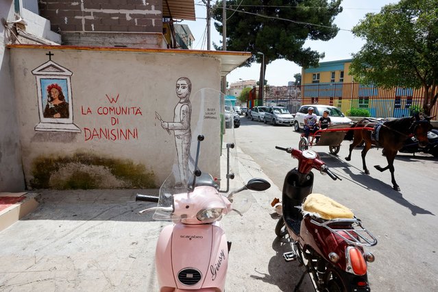Graffiti of Danisinni community is seen on a wall near the Saint Agnese parish in Danisinni district, Palermo, Italy, on May 14, 2025. (Photo by Igor Petyx/Reuters)