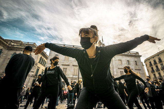 Teachers and students of dance schools dance maintaining social distance in Barcelona, Spain on November 9, 2020 during a protest against harsher anti-covid19 measures as closures in the hospitality and culture sector and limitations of social contacts by the Catalan government due to the accelerated spread of the coronavirus. (Photo by Matthias Oesterle/ZUMA Wire/Rex Features/Shutterstock)