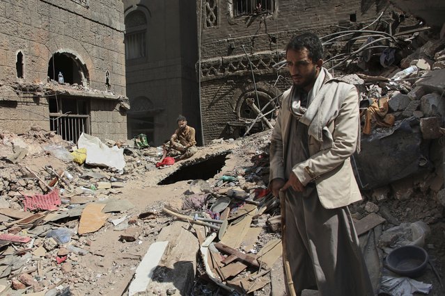 Two Yemeni men inspect the rubble of a house that was destroyed in Wednesday's Israeli airstrikes, in Sanaa, Yemen, Saturday, September 13, 2025. (Photo by Osamah Abdulrahman/AP Photo)