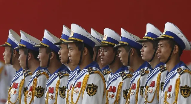 Members of the naval guard of honour stand during celebrations to commemorate the 70th anniversary of the establishment of the Vietnam People's Army at the National Convention Center in Hanoi December 20, 2014. (Photo by Reuters/Kham)