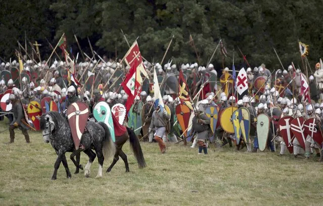 Re-enactors participate in a re-enactment of the Battle of Hastings, commemorating the 950th anniversary of the battle, in Battle, Britain October 15, 2016. (Photo by Neil Hall/Reuters)