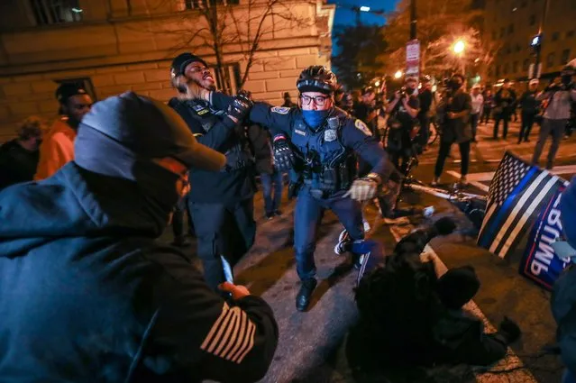 Police officers intervene a demonstrator as Proud Boys and Antifa fight after the “Million MAGA March” from Freedom Plaza to the US Capitol in Washington, DC, United States on December 12, 2020. Rally held to back President Donald Trump's unsubstantiated claims of voter fraud in the US election. (Photo by Tayfun Coskun/Anadolu Agency via Getty Images)
