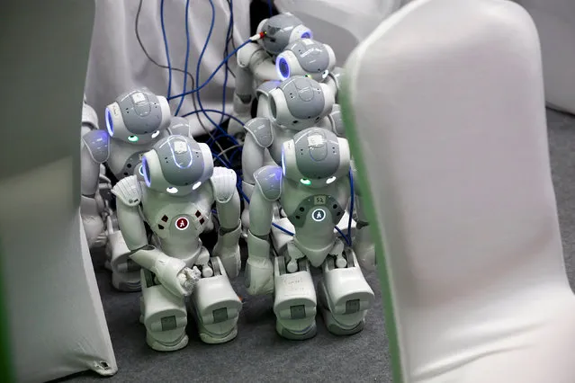 NAO robots are being charged at the WRC 2016 World Robot Conference in Beijing, China, October 21, 2016. (Photo by Thomas Peter/Reuters)