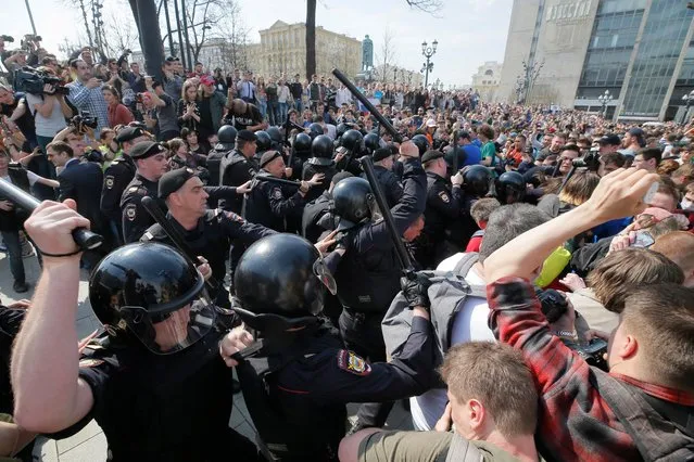 Russian riot police disperse and arrest participants of an unauthorized liberal opposition rally, called by their leader Alexei Navalny, prior to the official inauguration of president Putin, in Moscow, 05 May 2018. Russian opposition activists are continuing their protests against the re-election of president Vladimir Putin in March 2018. (Photo by Maxim Shipenkov/EPA/EFE)