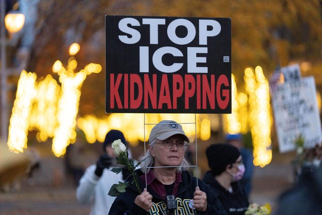 People listen to speakers during a Veterans Day protest before a march to a United States Immigration and Customs Enforcement (ICE) facility, Tuesday, November 11, 2025, in Portland, Ore. (Photo by Jenny Kane/AP Photo)