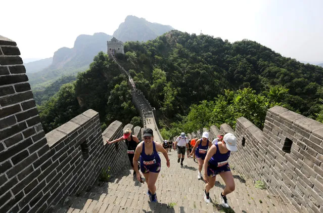 Participants run the Great Wall Marathon at the Huangyaguan section of the Great Wall of China, in Jixian, Tianjin, China May 19, 2018. The Great Wall Marathon, one of the world's most demanding long-distance races, was held along one of the new seven wonders of the world. (Photo by Jason Lee/Reuters)
