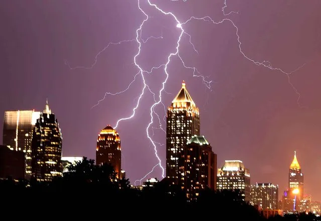 Lightning lights up the midtown Atlanta sky Tuesday evening July 14, 2015, as strong storms move through the area. (Photo by Ben Gray/Atlanta Journal-Constitution via AP Photo)