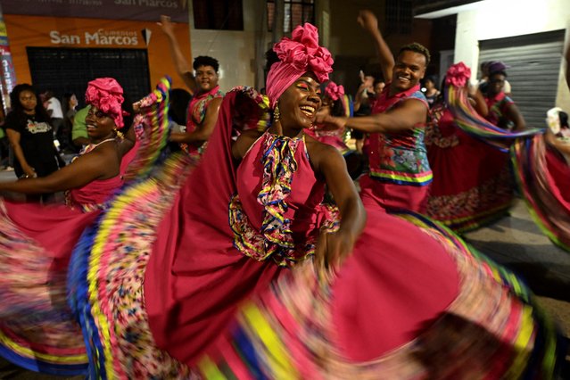 Folklore dancers peform during the 12th Carnival of the East (Carnaval de Oriente) in the Agualanca district in Cali, Colombia, on August 7, 2024. (Photo by Joaquin Sarmiento/AFP Photo)