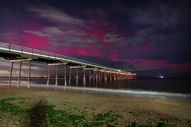 The Northern Lights visible through clouds over Saltburn-by-the-Sea in North Yorkshire, UK on Tuesday, September 2, 2025. (Photo by Owen Humphreys/PA Images via Getty Images)