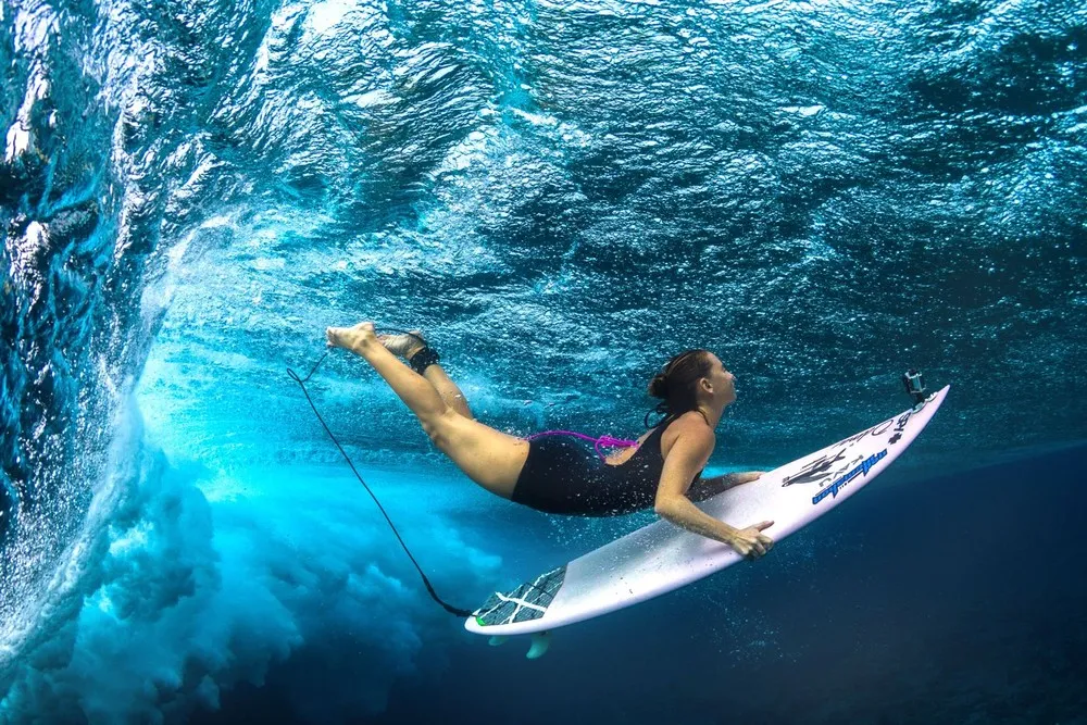Female Surfers Beneath the Waves
