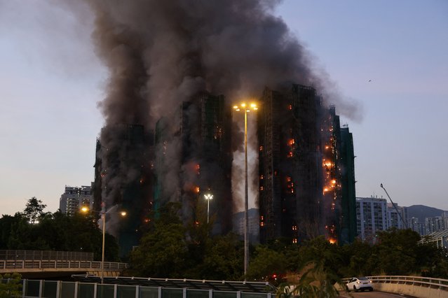 Fire burns bamboo scaffolding across multiple buildings at Wang Fuk Court housing estate, in Tai Po, Hong Kong, China, on November 26, 2025. (Photo by Tyrone Siu/Reuters)