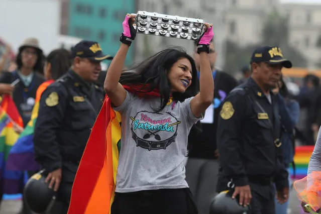 A participant attends the annual Gay Pride parade in Lima, Peru on June 30, 2018. (Photo by Guadalupe Pardo/Reuters)