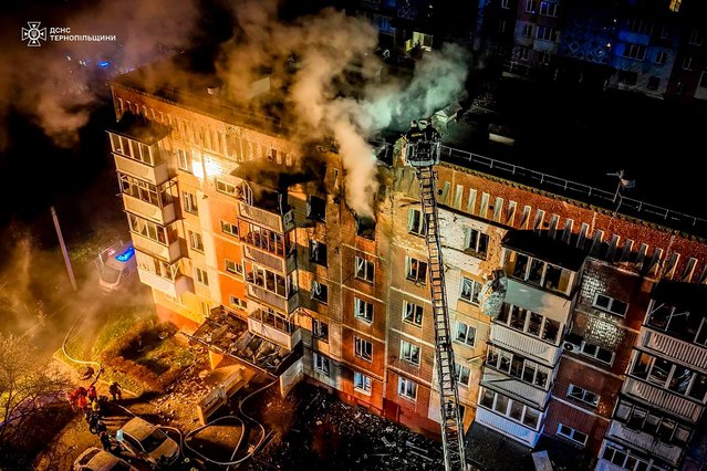 This handout photograph taken by the Ukrainian Emergency Service and released on December 2, 2024, shows a residential building on fire following a Russian air attack, in Ternopil, amid the Russian invasion of Ukraine. Ukraine announced on December 2, 2024, that it had been targeted by 110 Russian drones during the night, an attack that left one dead and three wounded in the town of Ternopil, in the west of the country, according to the authorities. (Photo by Handout/Ukrainian Emergency Service via AFP Photo)