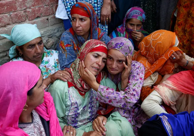 Relatives of 16-year-old girl Andleeb Jan, a civilian who according to local media died during clashes between protesters and Indian security forces, mourn during her funeral in South Kashmir's Kulgam district, July 7, 2018. (Photo by Danish Ismail/Reuters)