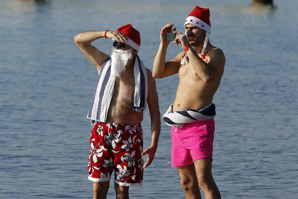 Santas Hit the Surf and Sand