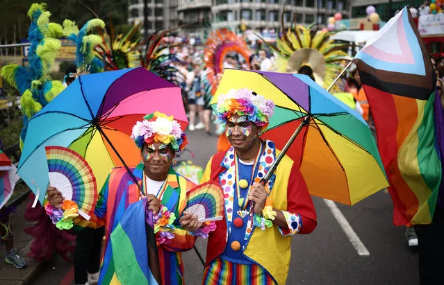 Members of the Lesbian, Gay, Bisexual and Transgender (LGBT+) community take part in the annual Pride Parade in the streets of London on July 1, 2023. (Photo by Henry Nicholls/AFP Photo)
