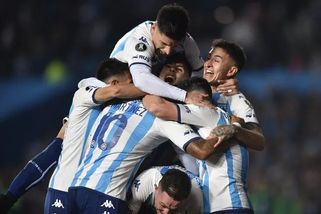 Argentina's Racing Club players celebrate their side's third goal after forcing an own goal by Juan Aguirre of Colombia's Atletico Nacional during a Copa Libertadores round of 16, second leg soccer match at President Peron stadium in Buenos Aires, Argentina, Thursday, August 10, 2023. (Photo by Gustavo Garello/AP Photo)