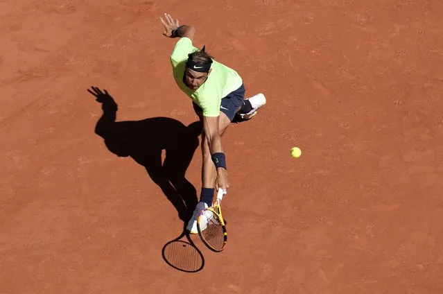 Spain's Rafael Nadal plays a return to Australia's Alexei Popyrin during their first round match on day three of the French Open tennis tournament at Roland Garros in Paris, France, Tuesday, June 1, 2021. (Photo by Christophe Ena/AP Photo)