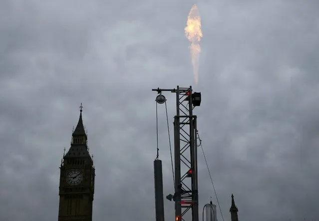 A fracking rig flares gas during an anti-fracking protest by Greenpeace activists outside the Houses of Parliament in London, Britain February 9, 2016. (Photo by Stefan Wermuth/Reuters)